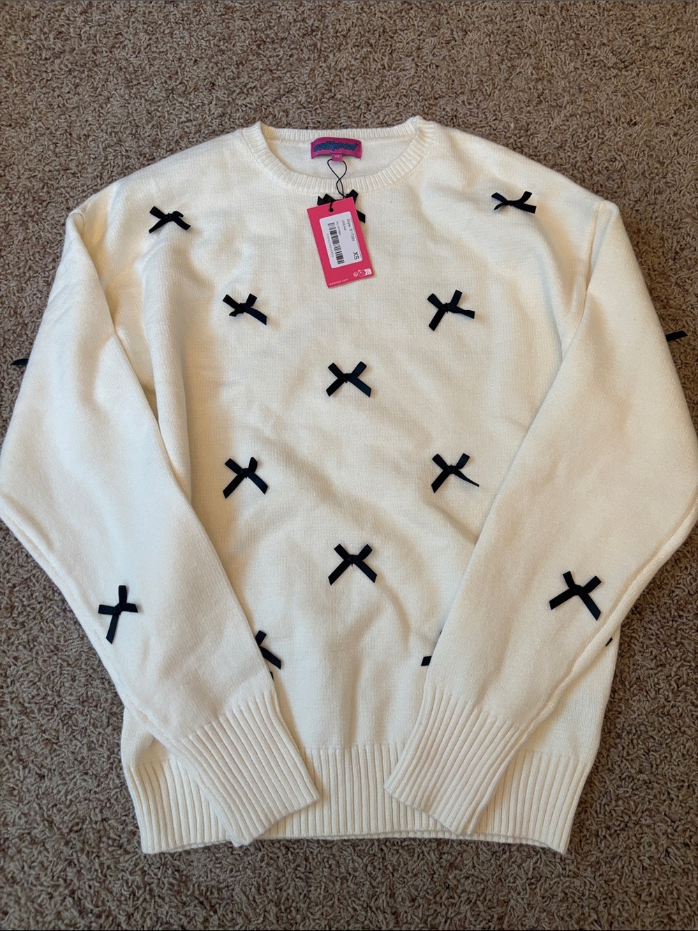 Edikted White Crewneck Sweater with Black Cross Appliqués